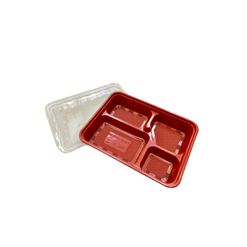 Red/black plastic bento tray with clear lid on a white background