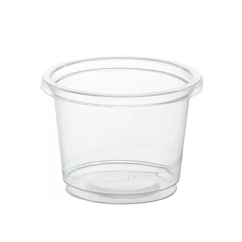 Clear plastic portion cup on a white background