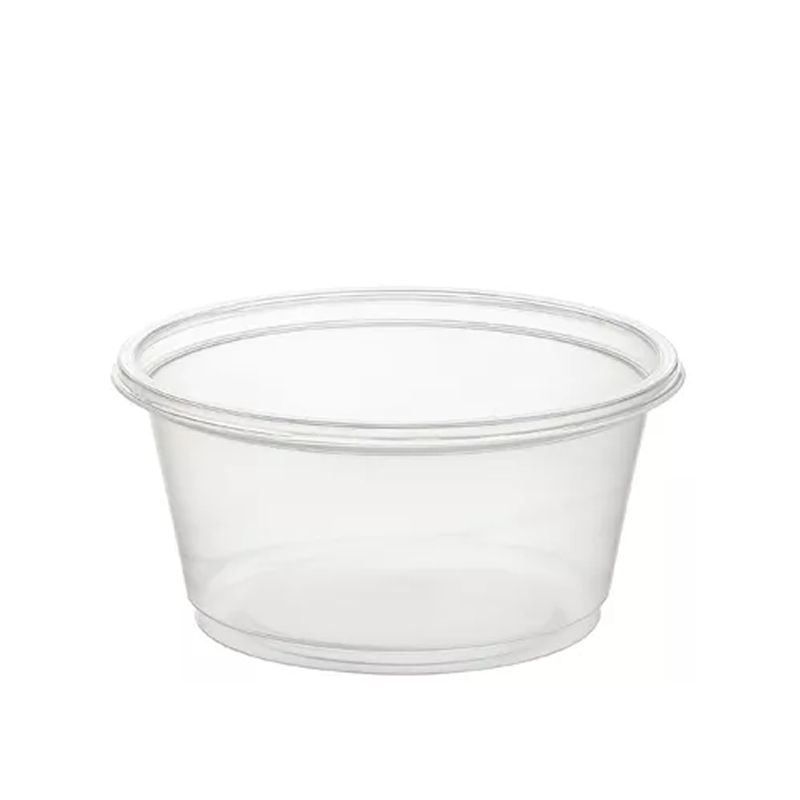 Clear plastic portion cup on a white background