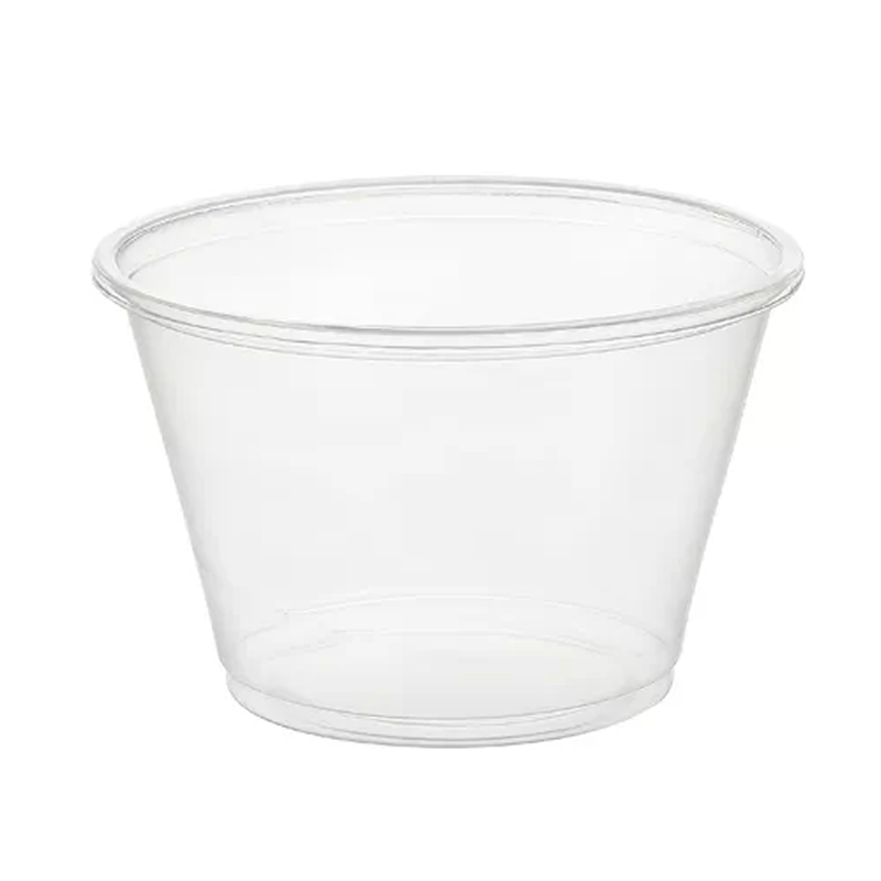 Clear plastic portion cup on a white background