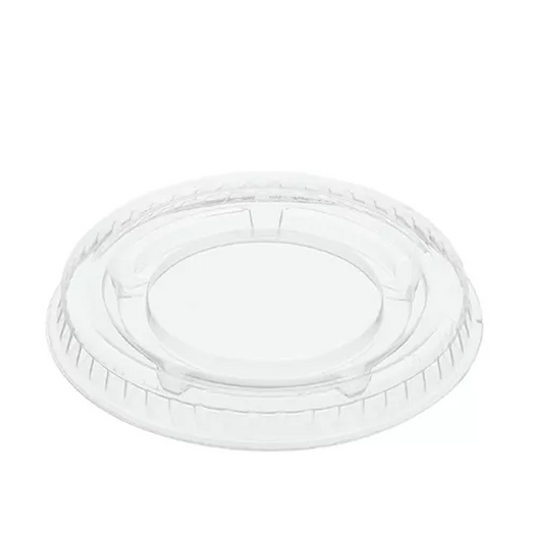 Clear plastic portion cup lid on a white background